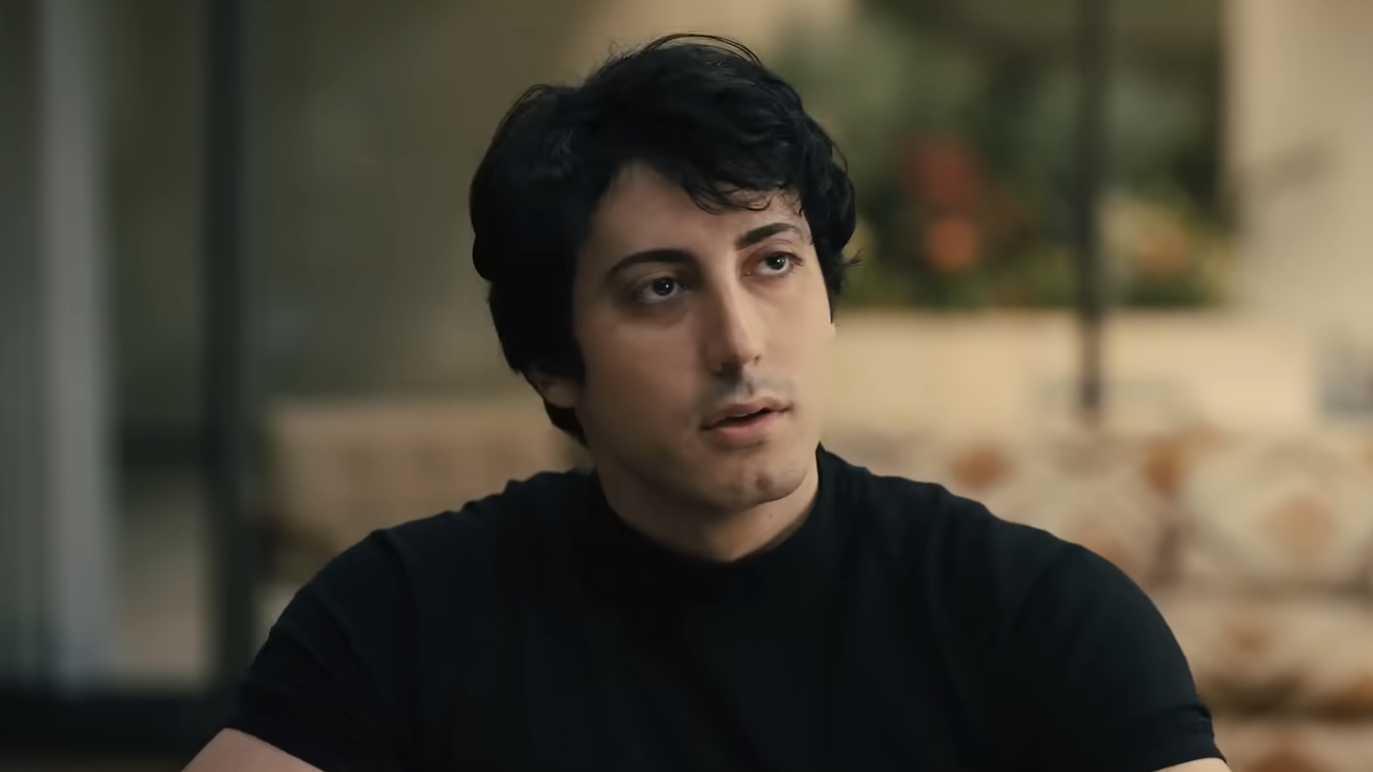 "Sylvester Stallone" in black shirt during pitch meeting in I Play Rocky