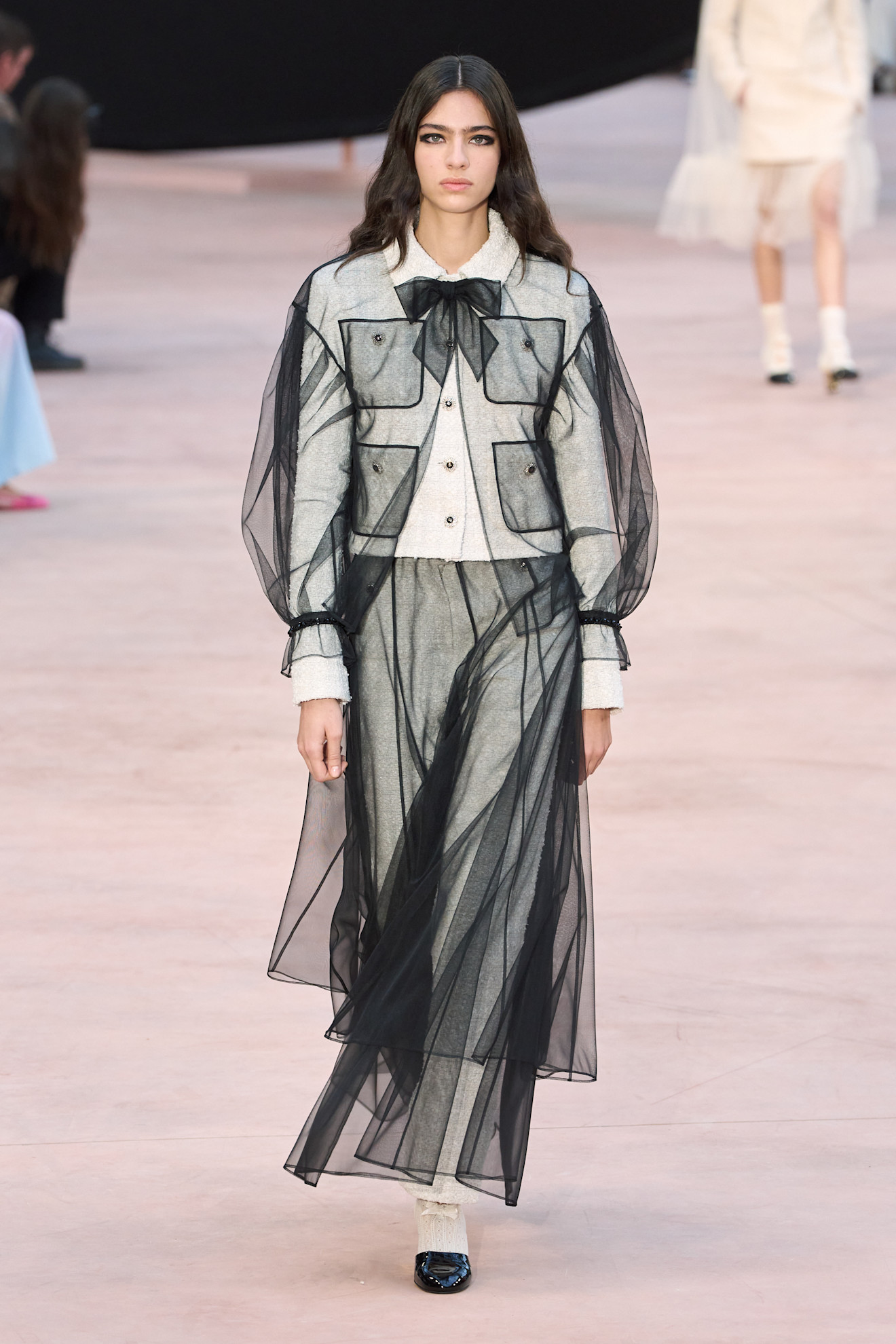 An image of the sheer blouse trend on the Chanel SS25 runway.