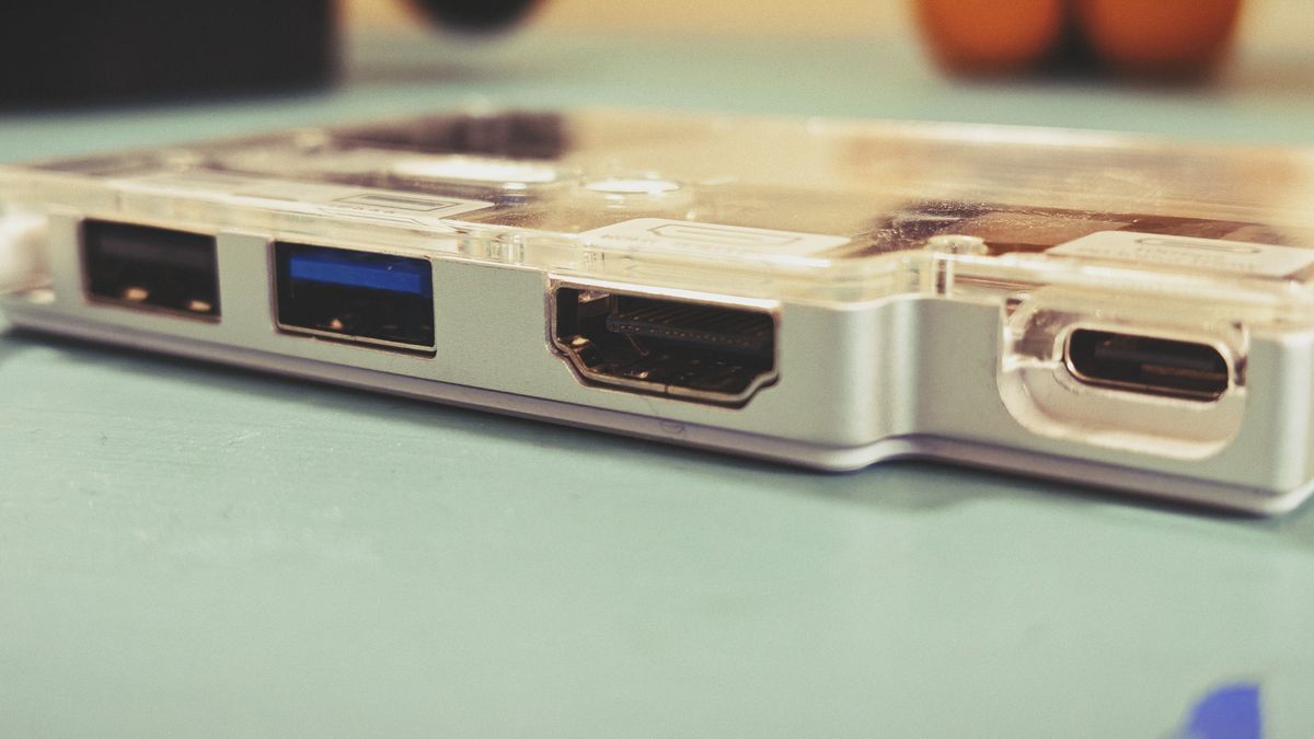 A Sharge Disk Pro SSD and USB dock on a green table