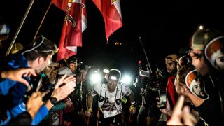 French athlete Mathieu Blanchard competes surrounded by supporters during the 20th edition of The Ultra Trail du Mont Blanc