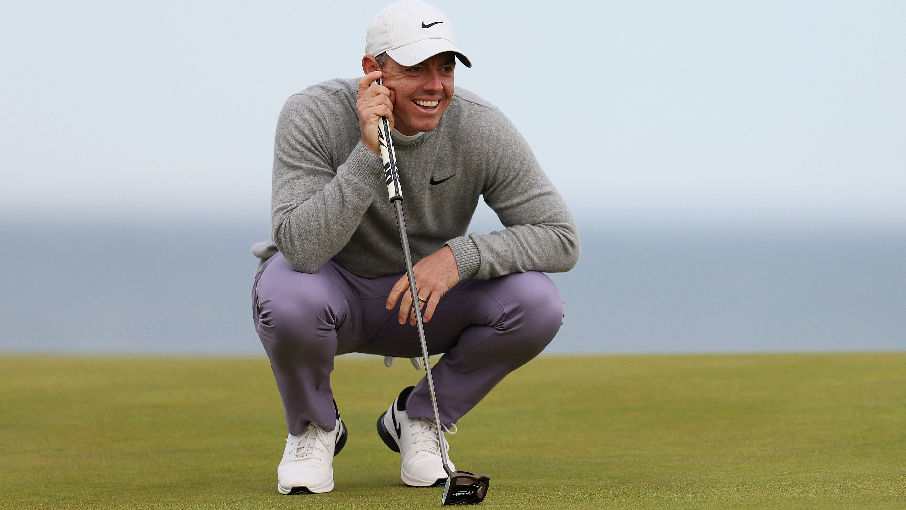 Photo of Rory McIlroy smiling at his mallet putter