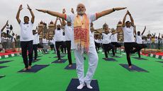 India's Prime Minister Narendra Modi performing yoga