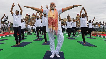 India's Prime Minister Narendra Modi performing yoga