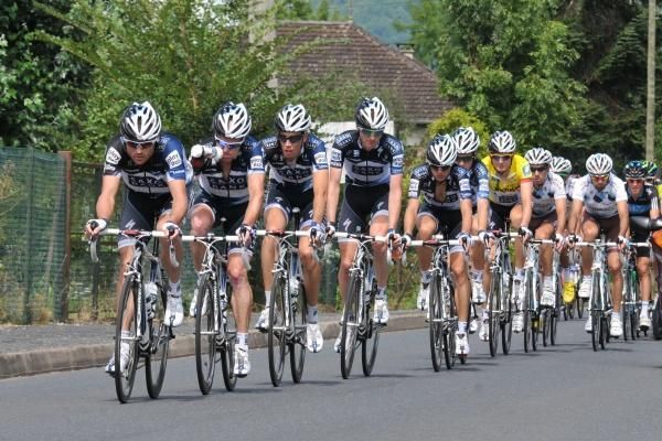 Saxo Bank assumes the pace-making duties in the peloton.
