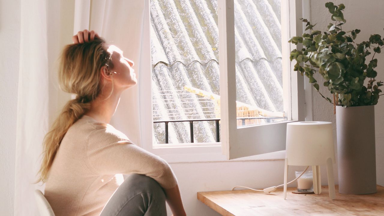 Woman looking out of window