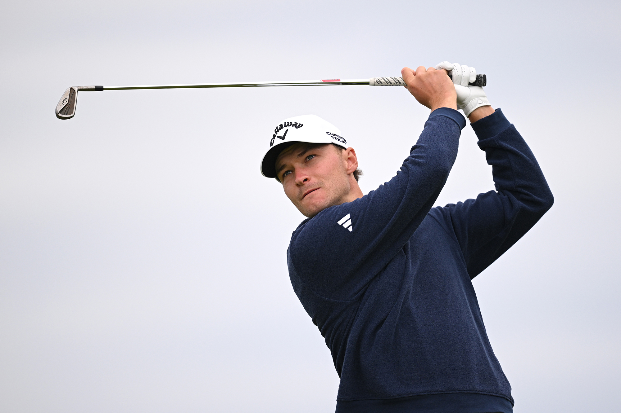 Rasmus Hojgaard in the finish position with an iron, after hitting an iron shot at the open championship at royal portrush