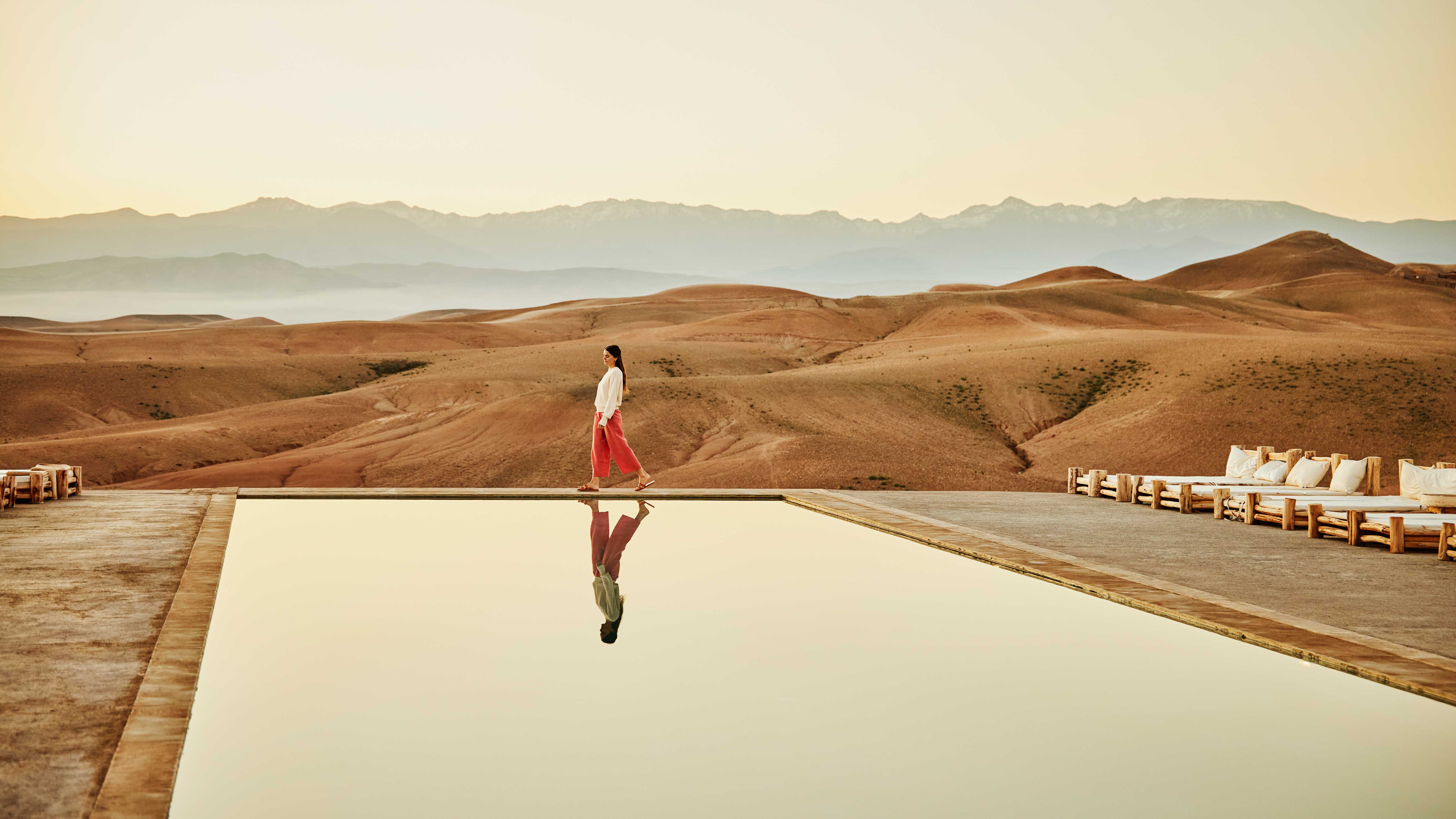 Woman in desert by pool