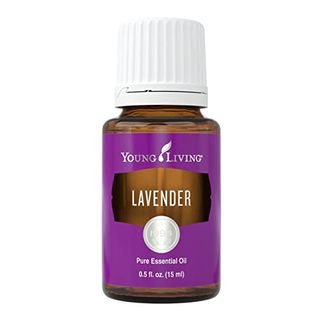 Lavender Essential Oil by Young Living. Amber glass bottle with a white lid and purple label