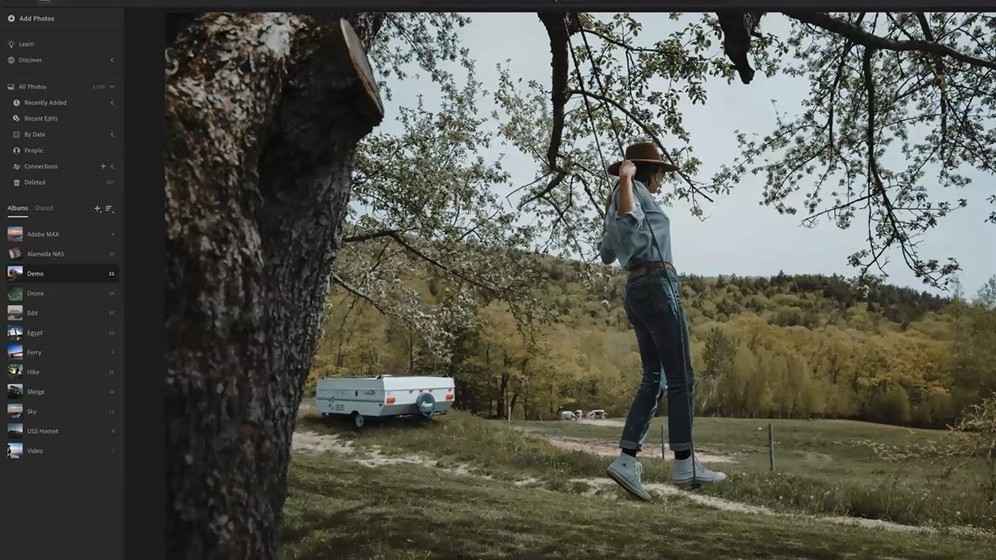 Screengrab of Lightroom interface showing photo of man swinging from tree