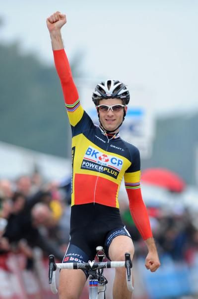 Niels Albert (BKCP-Powerplus) raises his arm in celebration.