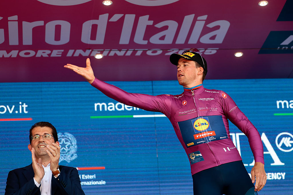 Lidl-Trek's Danish rider Mads Pedersen wearing the best sprinter's red jersey (Maglia Rossa) poses on the podium celebrates on the podium after the 18th stage of the 108th Giro d'Italia cycling race of 144kms from Morbegno to Cesano Maderno on May 29, 2025. (Photo by Luca Bettini / AFP)