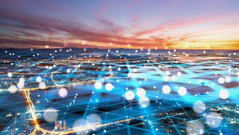 A digital grid criss-crossing the lights of a city below