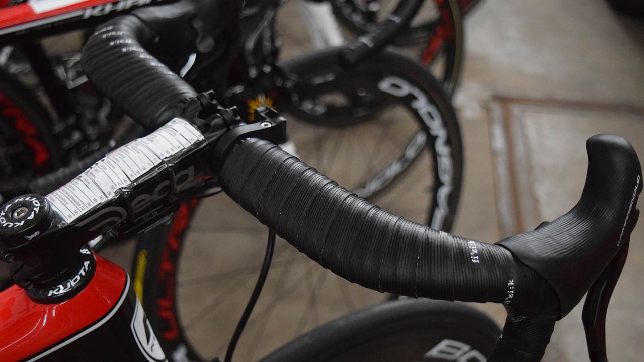 Cobbled roads mean aero bars aren't the comfiest option so many riders will wrap handlebar tape to their stems