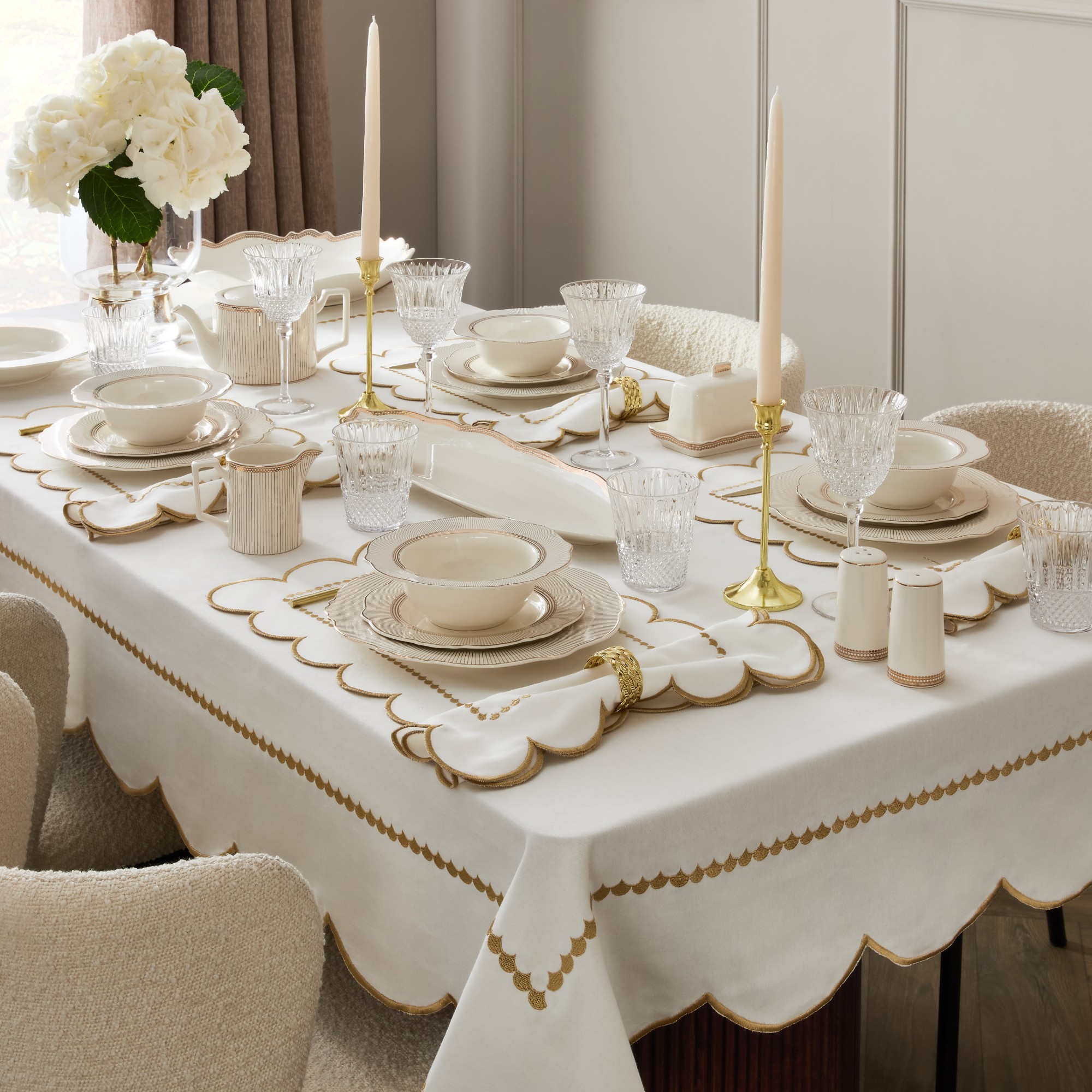 A dining table set with art deco-style pieces from the Primark Home The Edit collection