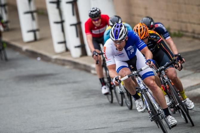 A chase group goes after the three riders up the road.