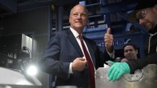 U.S. Treasurer Brandon Beach holds up final penny minted after 232 years