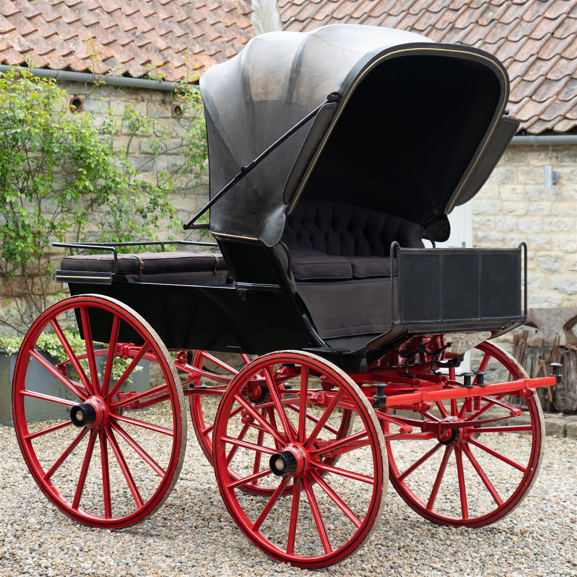 A hooded, horse-drawn mail phaeton
