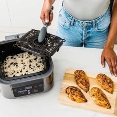 Image of Ninja Speedi multicooker used to make rice and chicken on countertop 