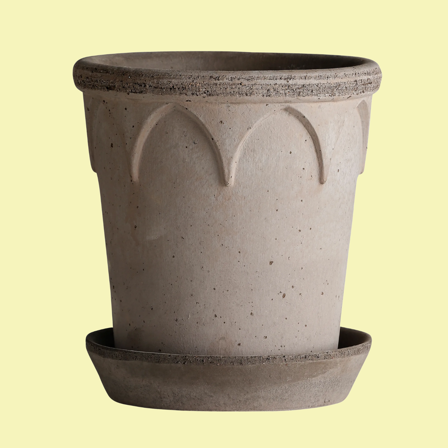 A raw clay flower pot and saucer
