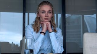 Sophie Turner clasps her hand under her chin