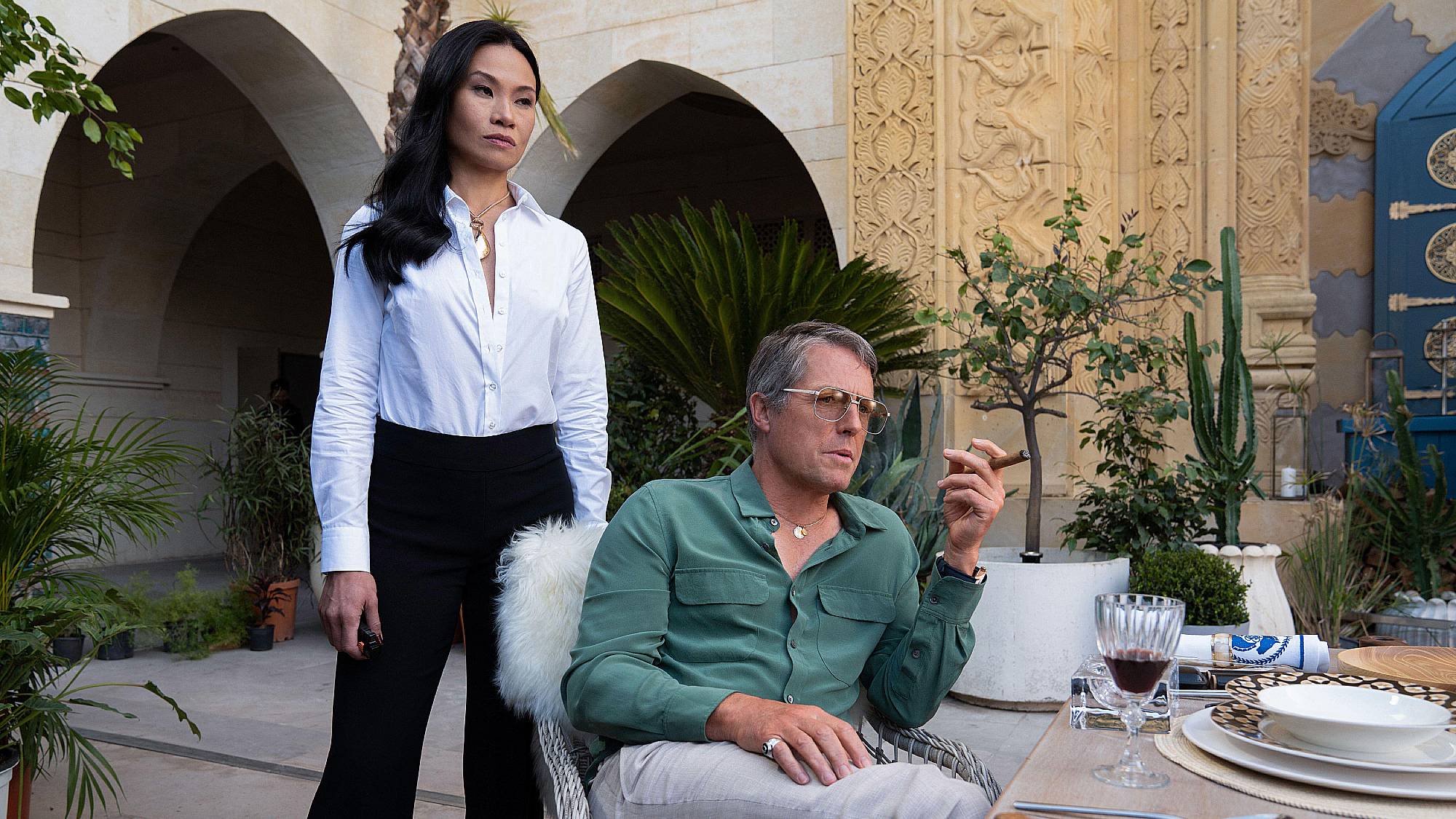 Lourdes Faberes and Hugh Grant in "Operation Fortune: Ruse de Guerre" (2023)