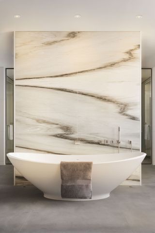 bathroom with marble panel and built in light speakers