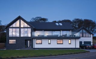 Contemporary timber frame Self Build Home with large windows
