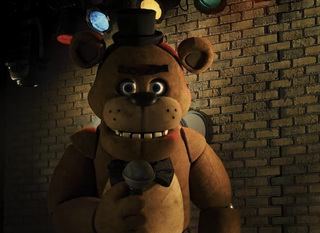 Freddy Fazbear with a top hat and microphone
