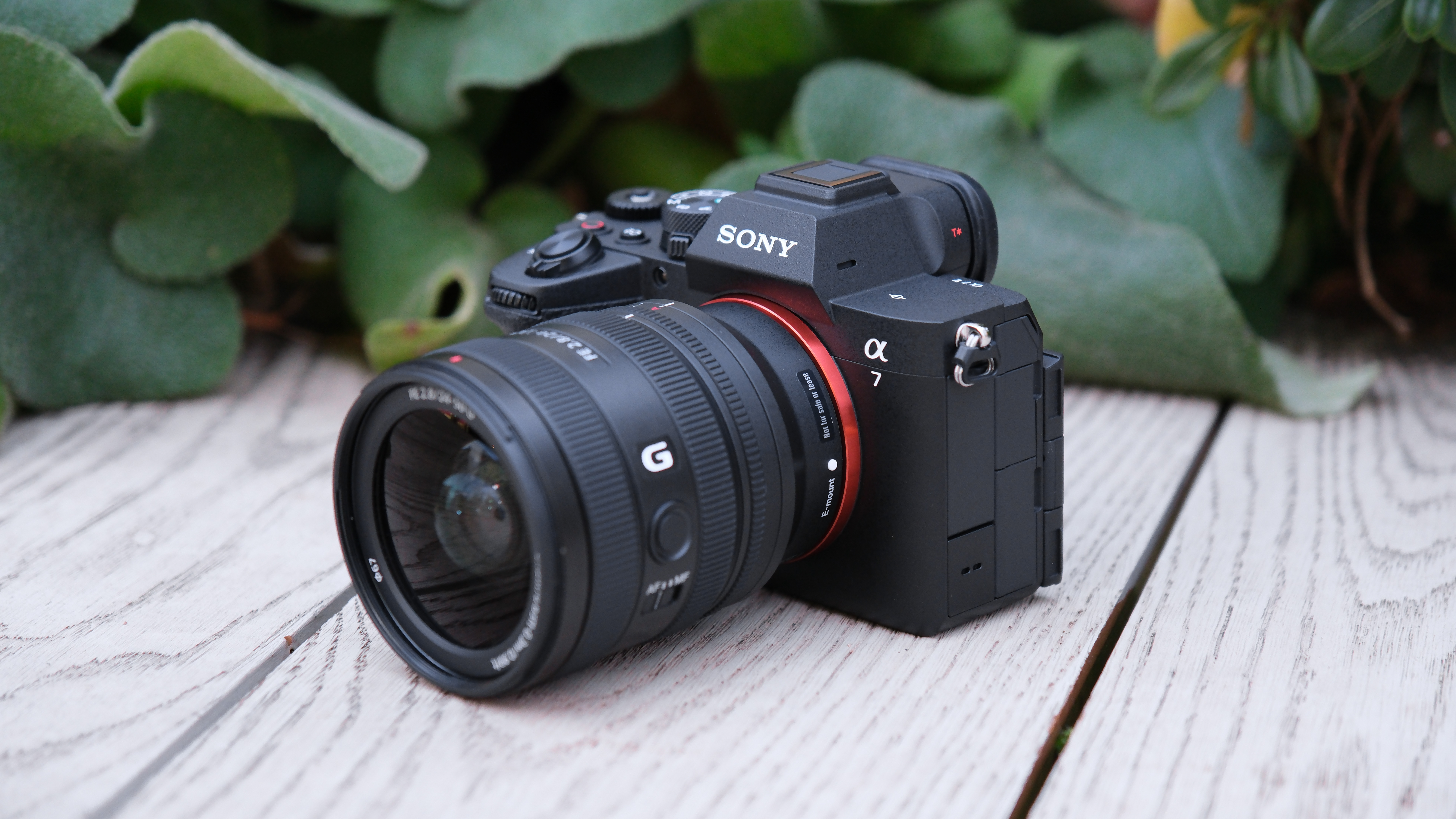 Sony A7 V camera with lens attached on a wooden surface