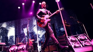 Josh Homme onstage at the KROQ Almost Acoustic Christmas show