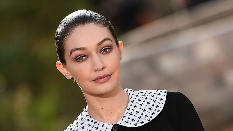US model Gigi Hadid presents a creation by Chanel during the Women's Spring-Summer 2020/2021 Haute Couture collection fashion show at the Grand Palais in Paris, on January 21, 2020. - The Grand Palais was turned into the garden of the Cistercian abbey in Aubazine, central France, where Gabrielle "Coco" Chanel grew up. (Photo by CHRISTOPHE ARCHAMBAULT / AFP) (Photo by CHRISTOPHE ARCHAMBAULT/AFP via Getty Images)