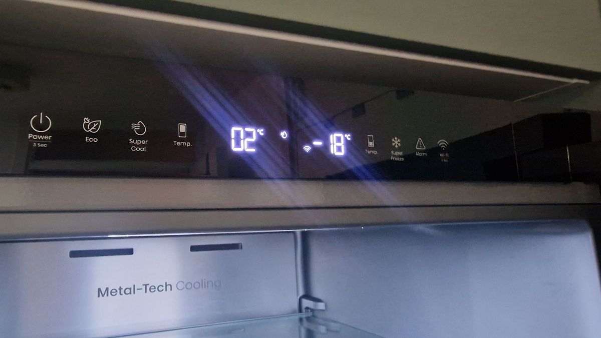 Hisense RB5K330GSFC in a green modern kitchen