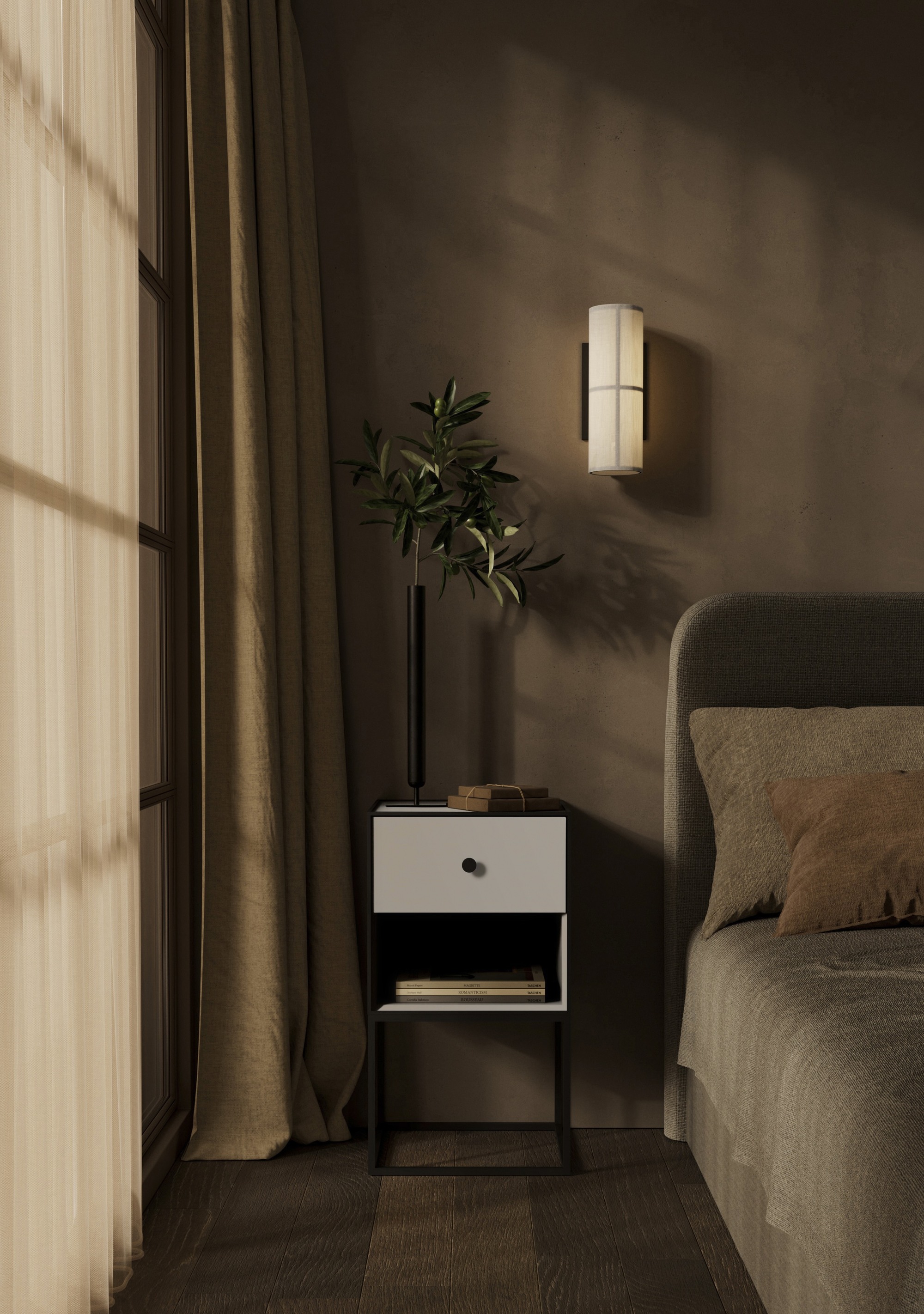 moody dark bedroom with brown walls, brown bedhead and sheets, a side table with a vase of foliage and decor, a decorative wall sconce and curtains covering the windows