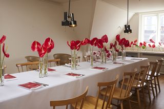 A table laid with anthurium flowers