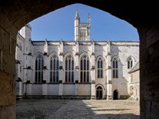 Fig 1: Chapel and the hall range with the 1470s tower, all of which are built of cut stone. Note the different treatment of the windows to Chapel (left) and Hall (right). Winchester College, Hampshire. Photographed by Paul Highnam for Country Life.