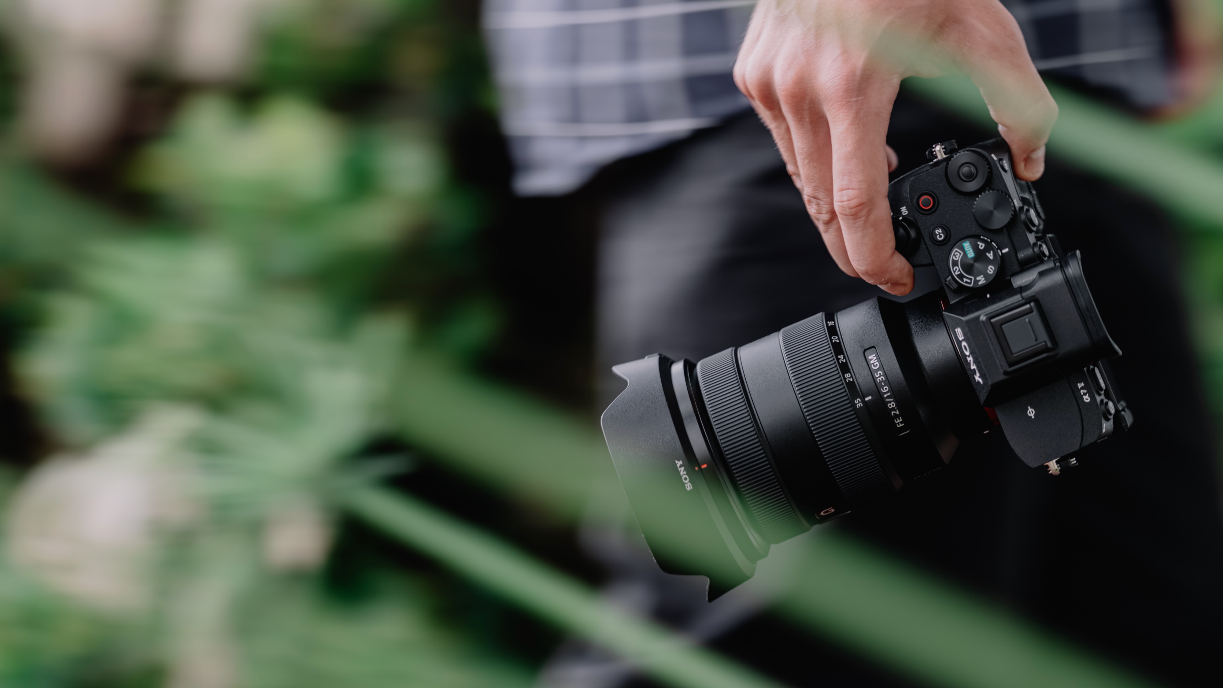 A person holding the Sony A7 V camera