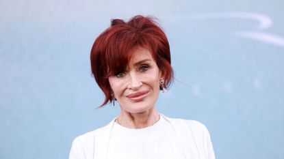 sharon osbourne on a blue background