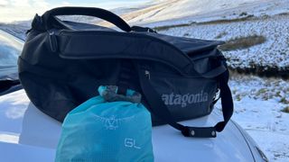 Lashing a dry bag to the Patagonia Black Hole Duffel