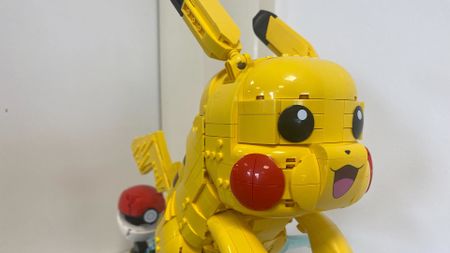 Lego Pikachu and Poke Ball set against a white background