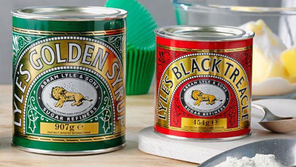 Lyle&#039;s Golden Syrup and Lyles Black Treacle tins showing the lion logo