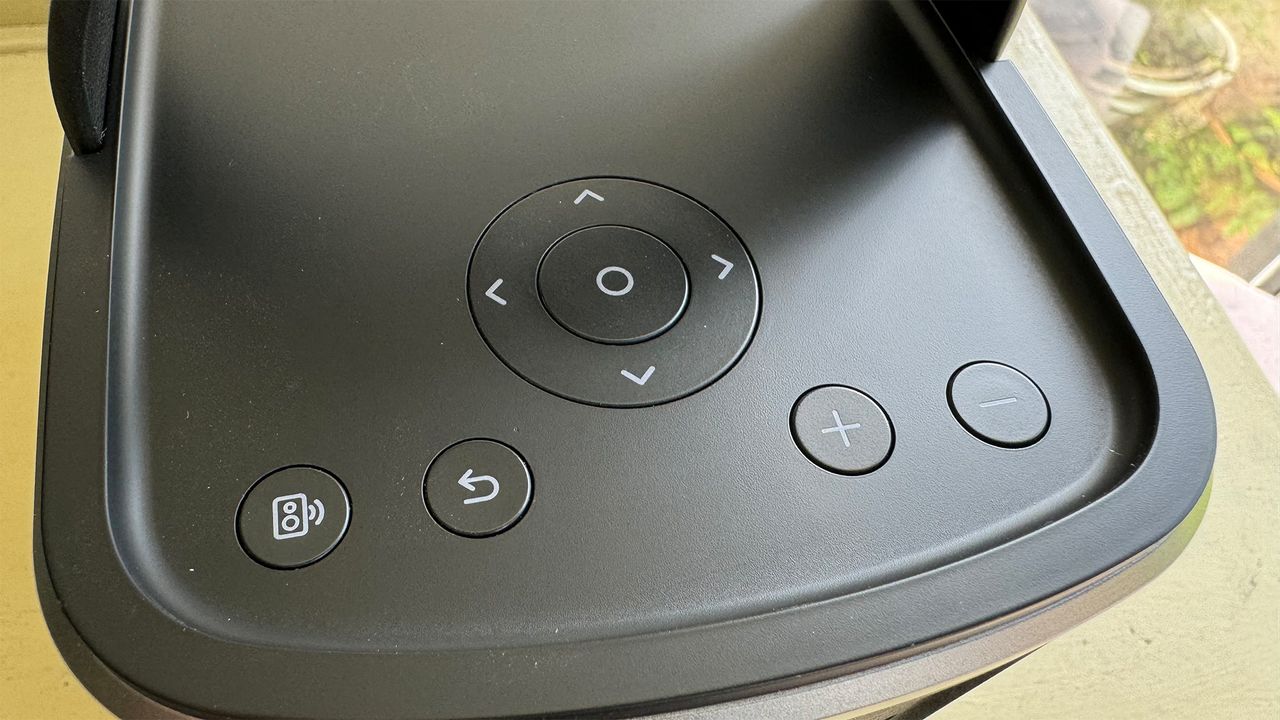 A close-up of the controls on top of the Anker Nebula Mars 3 Air portable projector.