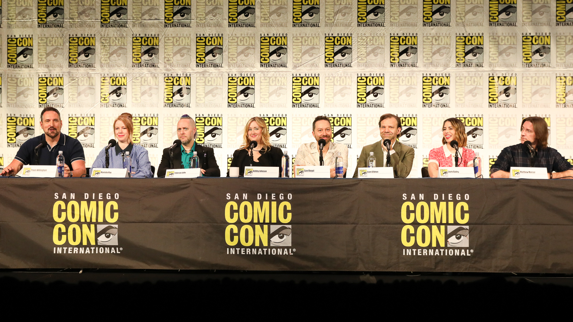 L-R: Critical Role's Travis Willingham, Marisha Ray, Taliesin Jaffe, Ashley Johnson, Sam Reigel, Liam O'Brien, Laura Bailey and Matthew Mercer on stage during the Critical Role on Prime Video panel at San Diego Comic Con 2025