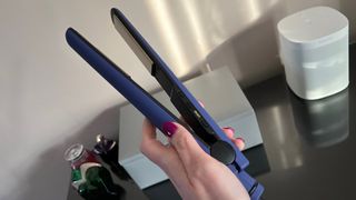 The Hot Tools Pro Signature Digital Straightener being held on its side