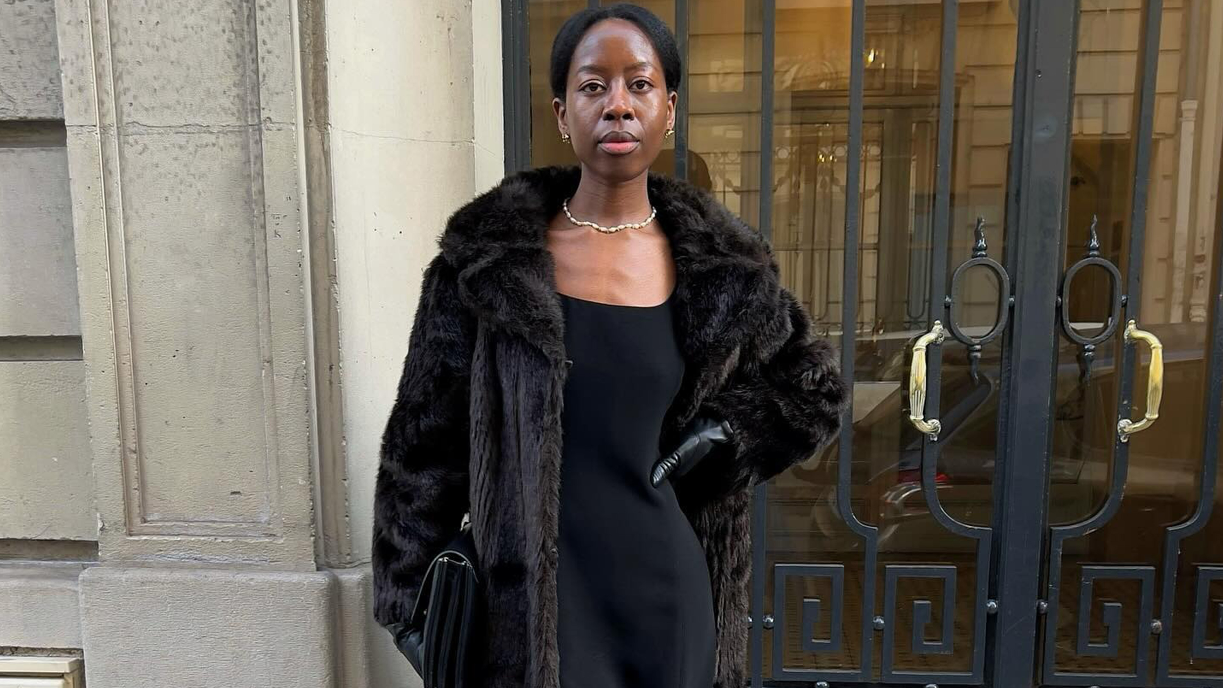 Sylvie Mus wearing a winter coat and gloves.
