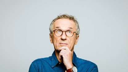 Headshot of thoughtful senior man 