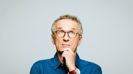 Headshot of thoughtful senior man 