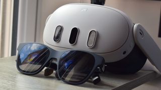 XREAL Air 2 AR Smart Glasses and a Meta Quest 3 VR headset next to one another.