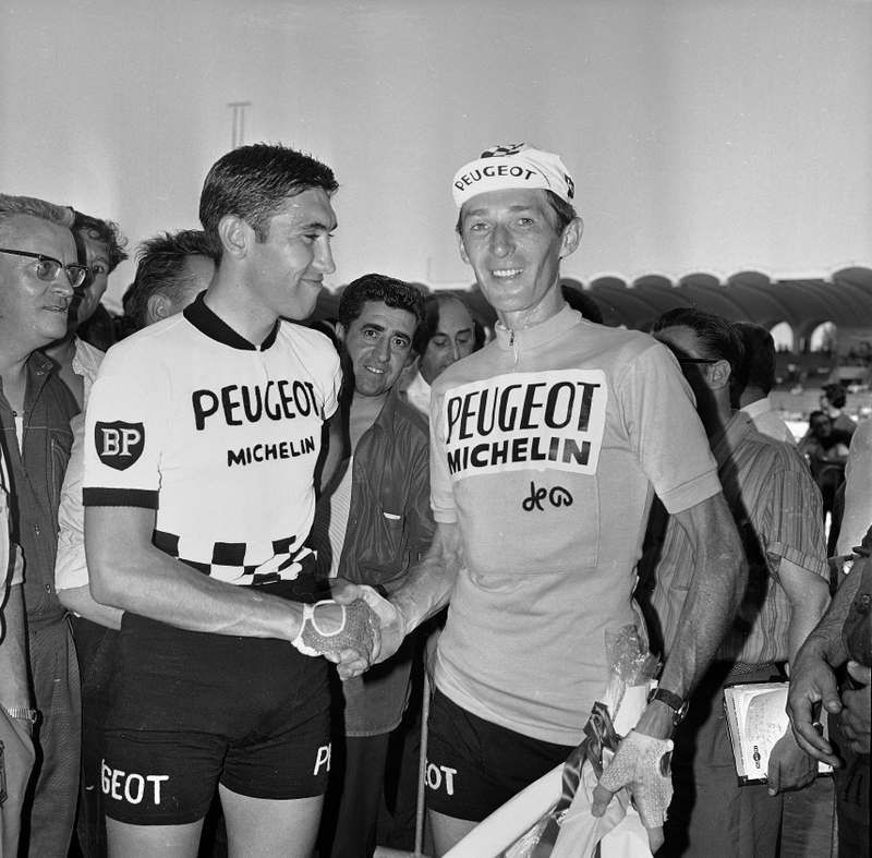 Eddy Merckx shakes the hand of overall winner Roger Pingeon at the 1967 Tour