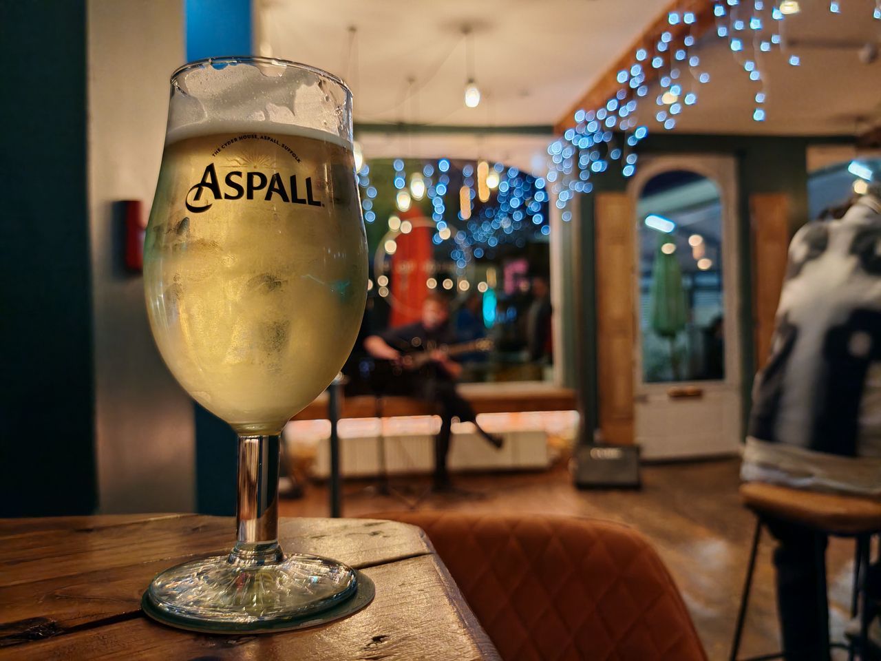 Glass of wine in a dimly lit pub