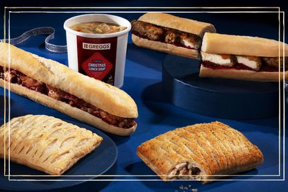 Greggs 2022 Christmas Menu featuring the Festive Bakes, Pigs in Blanket Baguettes and the new Christmas Lunch soups on a blue backdrop